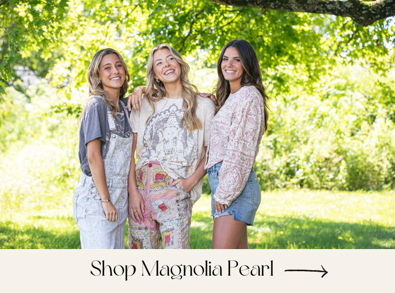 Three models wearing magnolia pearl