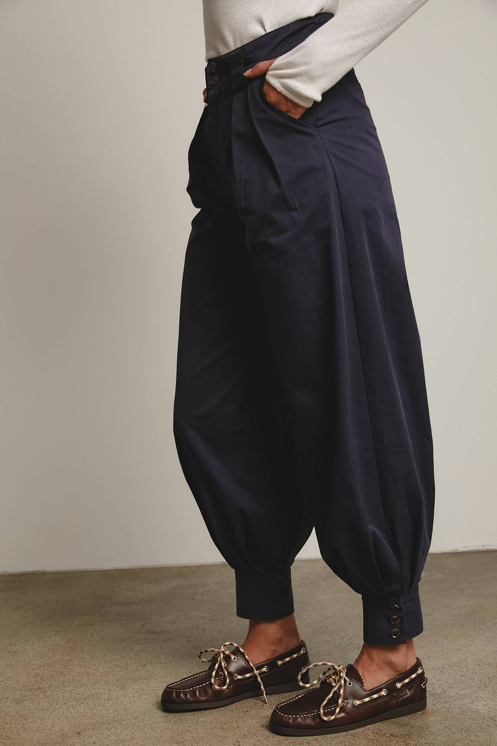 High-Waisted Pleated Tapered Pants with Button Cuff Detail